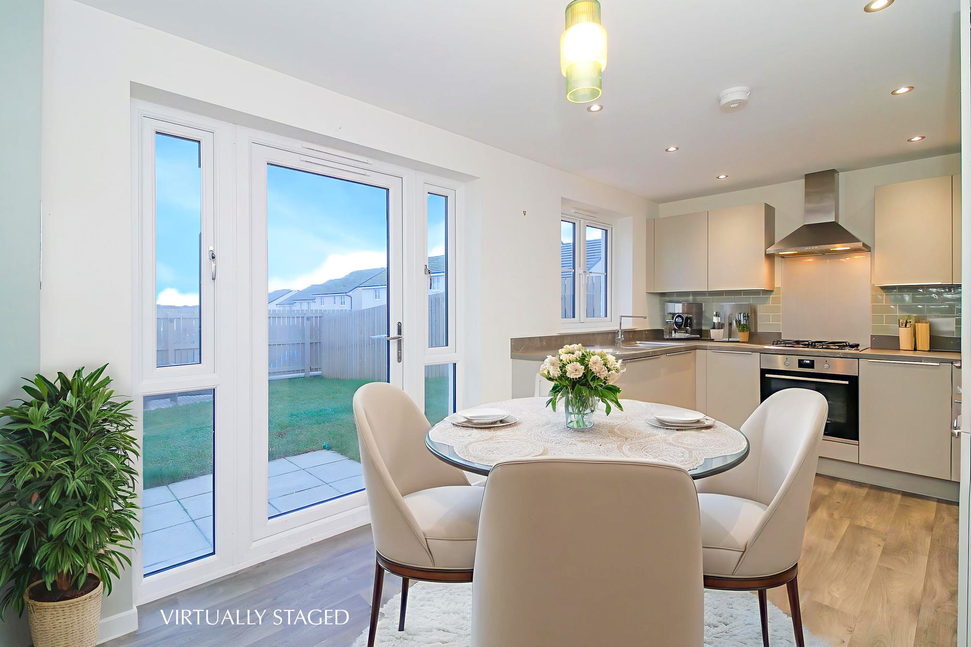 Kitchen and dining area (virtually staged)