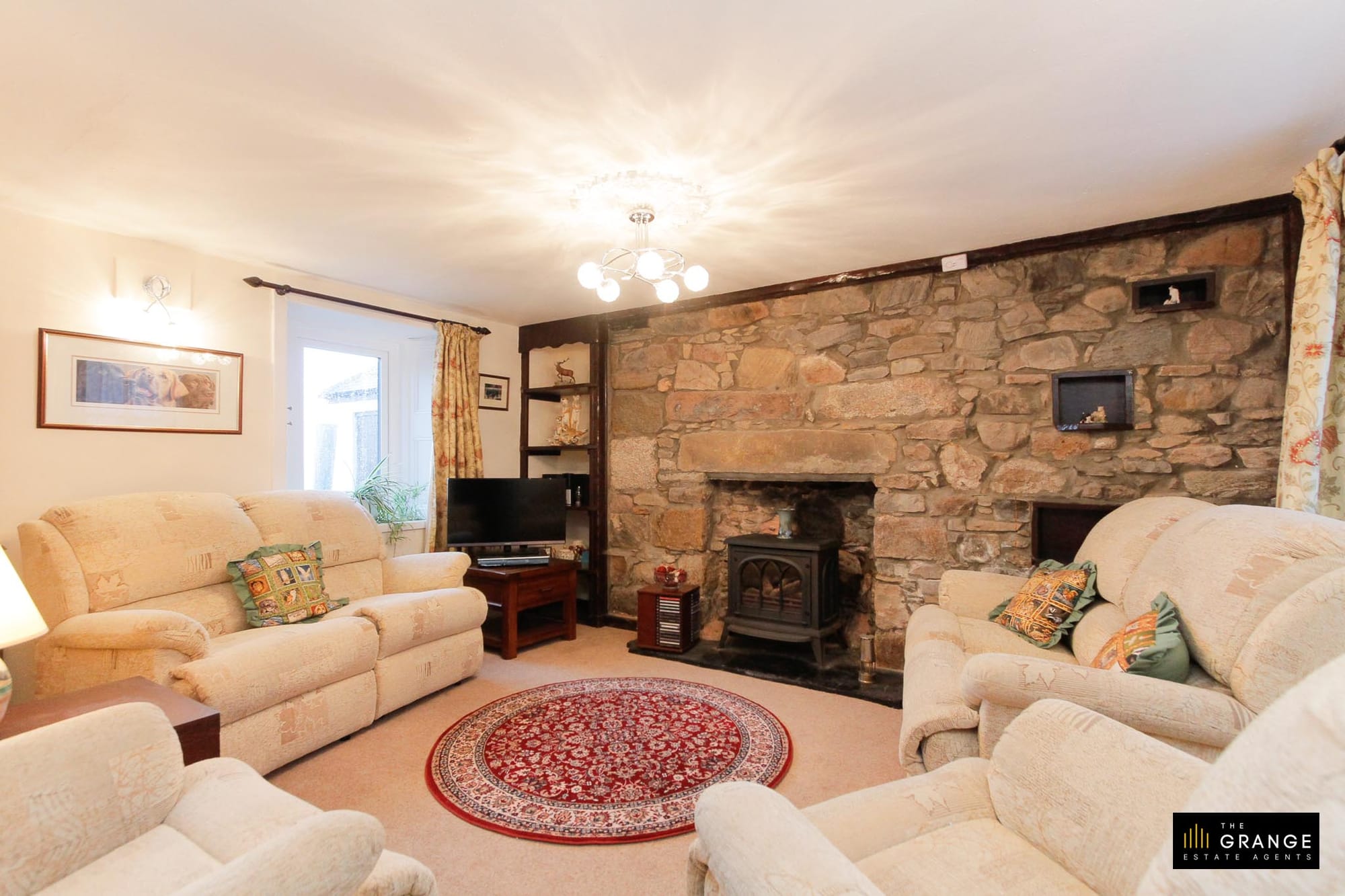 Living room with stone fireplace