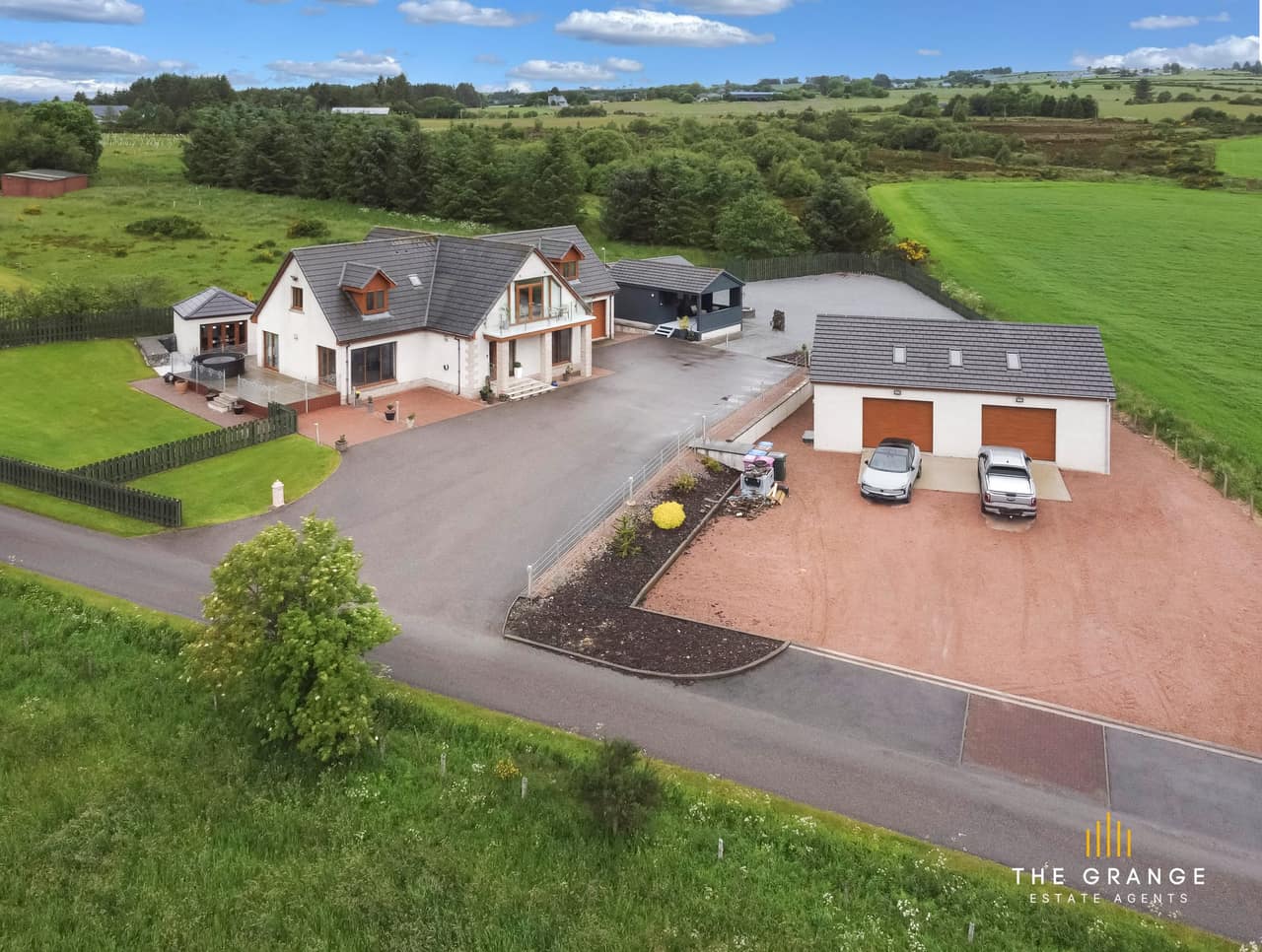 Aerial view of the property and surrounding farmland