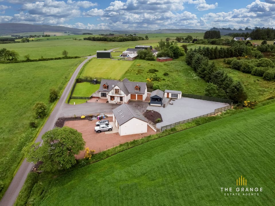 Aerial view of the house and its grounds