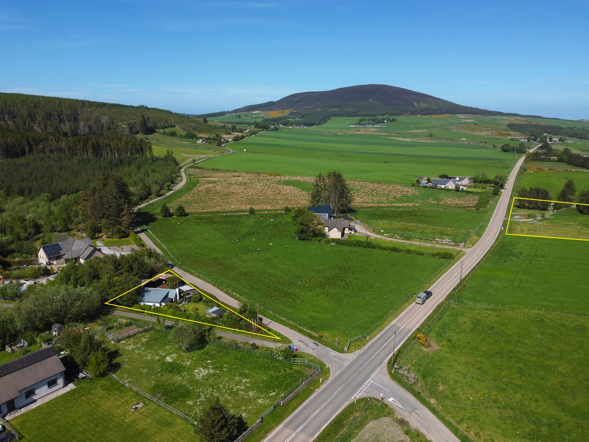 Aerial view of the property and surrounding land