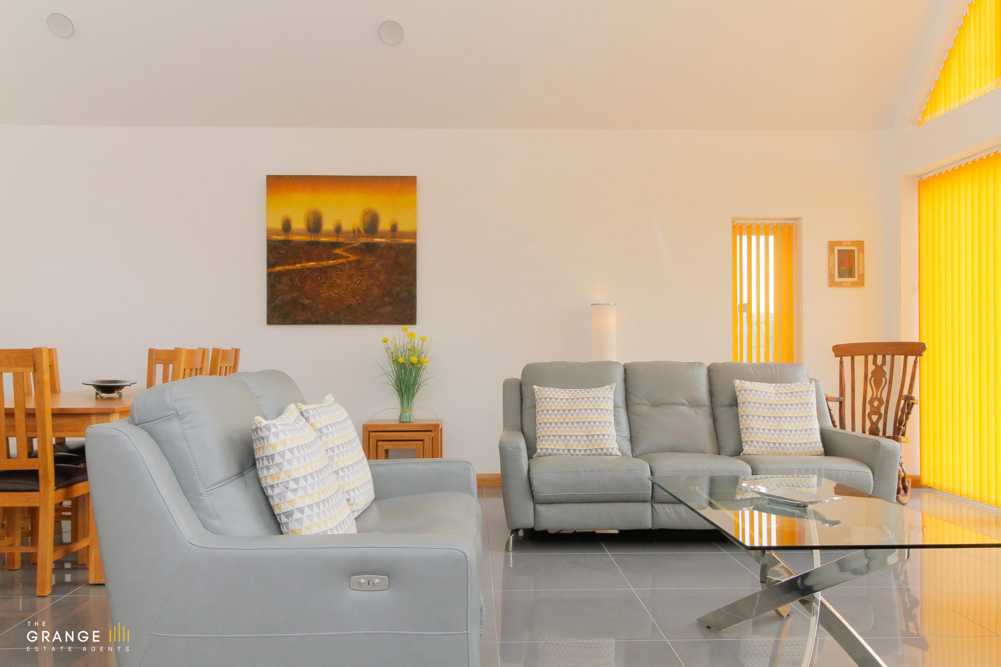Living room seating area with garden views