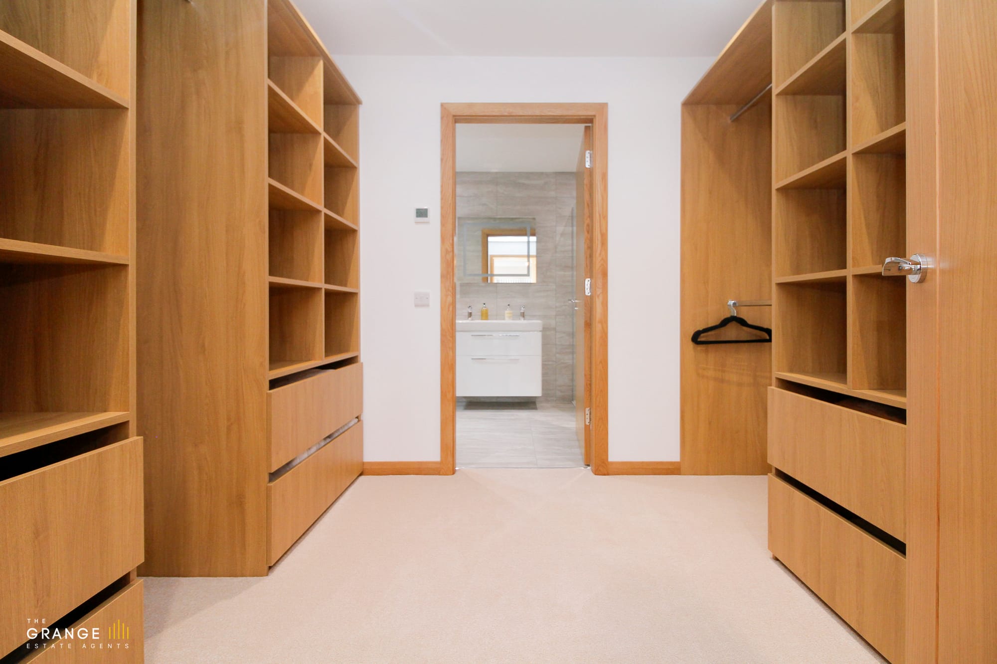 Walk-in wardrobe with fitted shelving