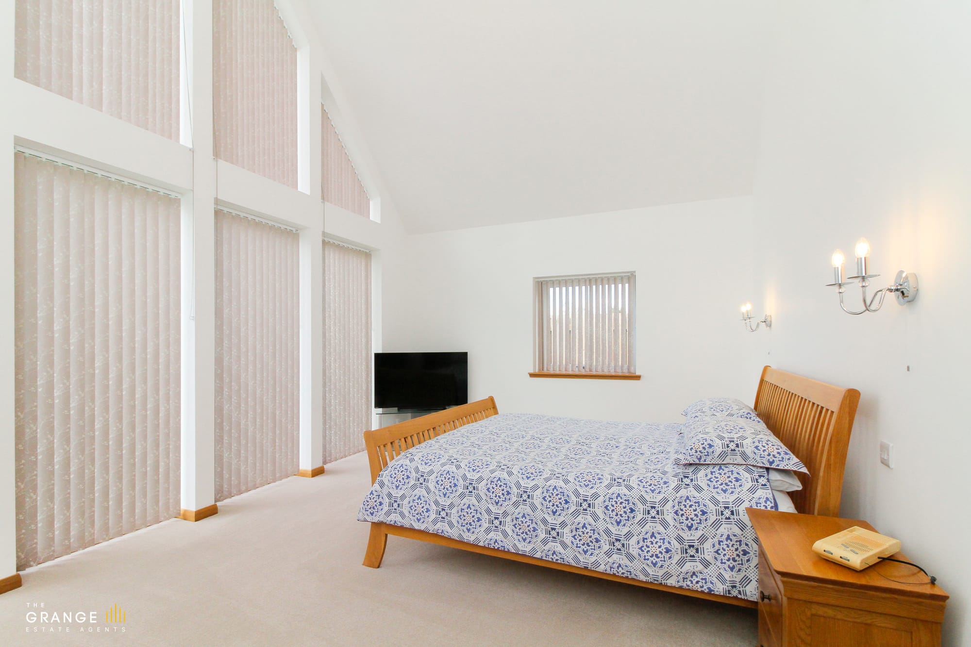 Bedroom with mirrored fitted wardrobes